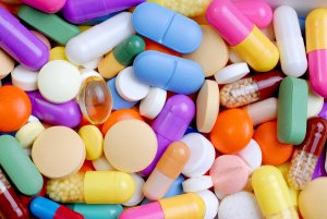 podporil_UK_logo_svisle_ZELENE_CMYK