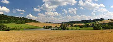 podporil_UK_logo_svisle_ZELENE_CMYK